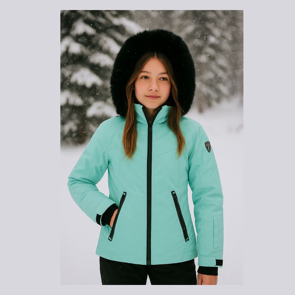 Degre 7 Geod Girls Ski Jacket with a snowy background
