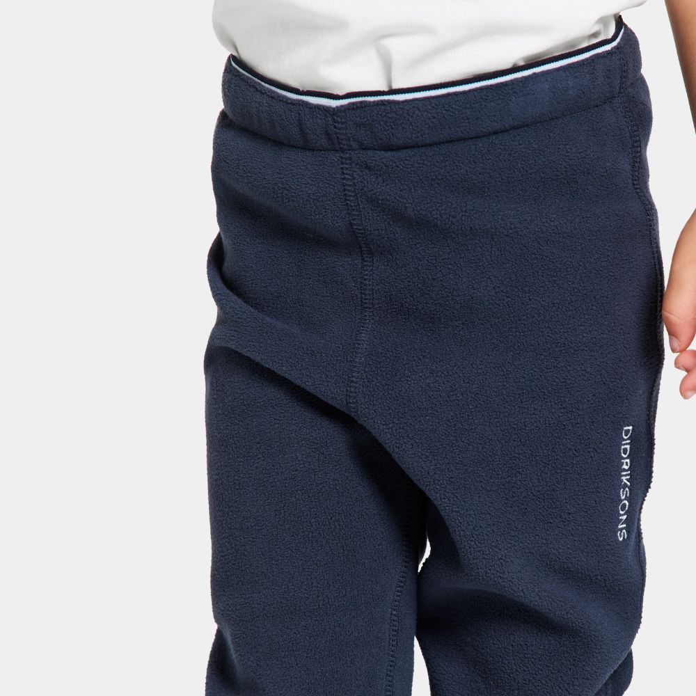 Didriksons Monte Kids Fleece Leggings in Navy.  Ideal for layering when skiing early season, high resports or Lapland Holidays 
