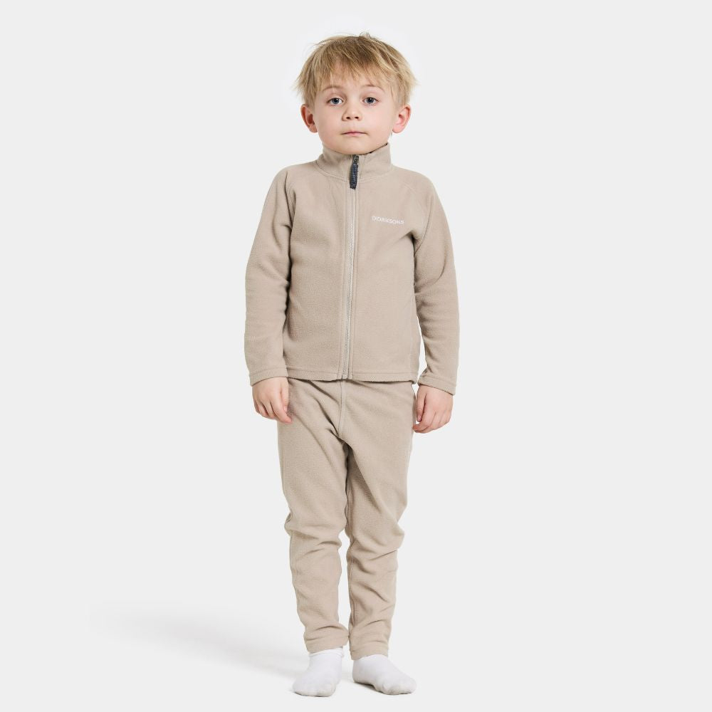 Didriksons Monte Kids Fleece Leggings in Beige.  Ideal for layering when skiing early season, high resports or Lapland Holidays 