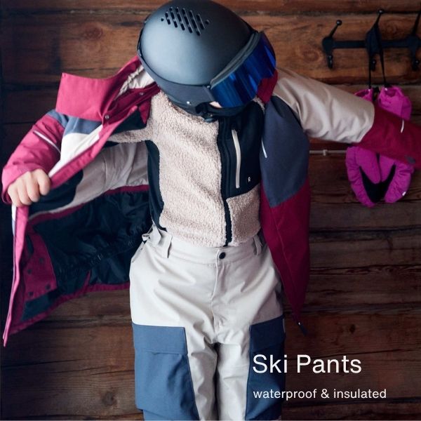 A child wearing ski pants - waterproof and insulated kids ski pants 